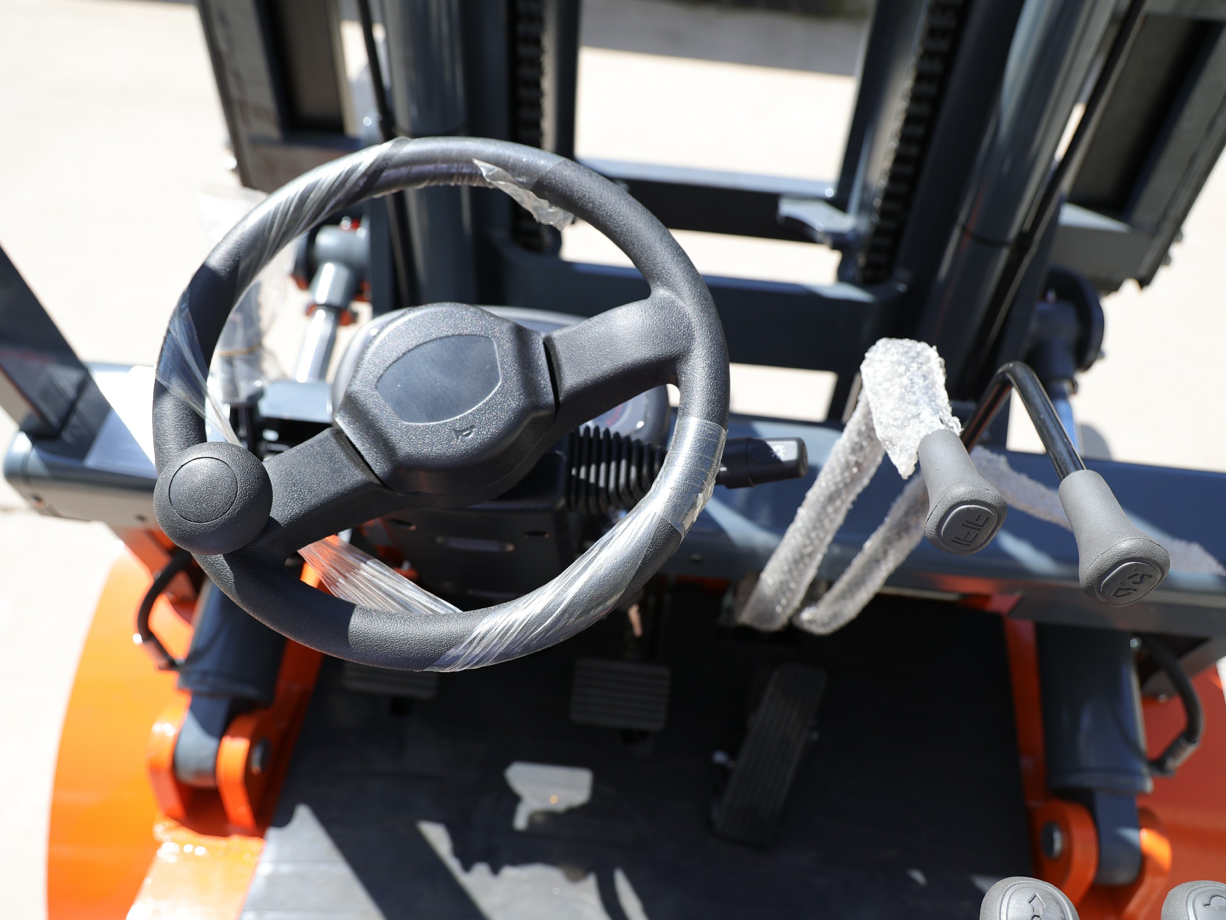 Close-up of the HYP50 steering wheel and control levers
